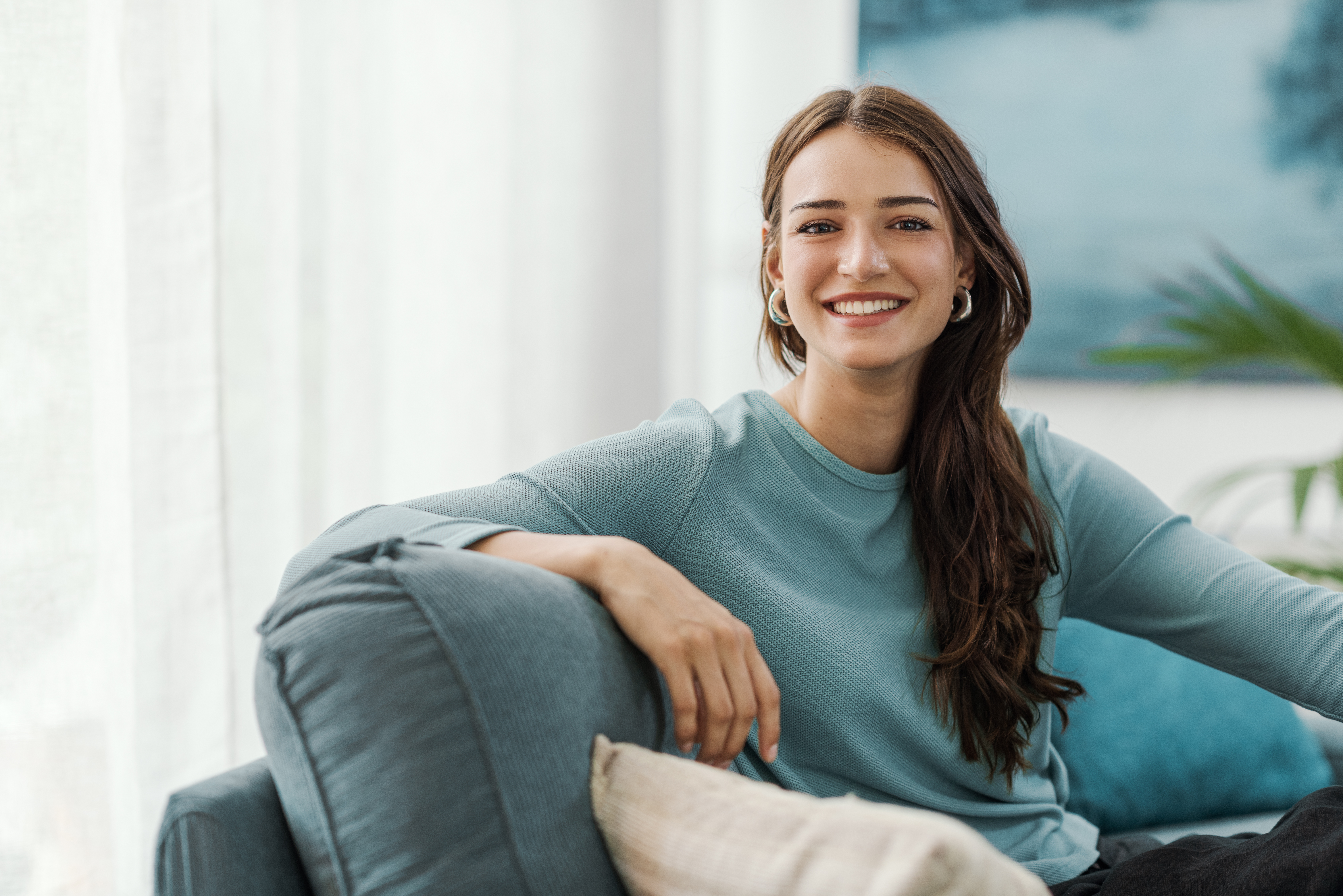Smiling woman relaxing at home