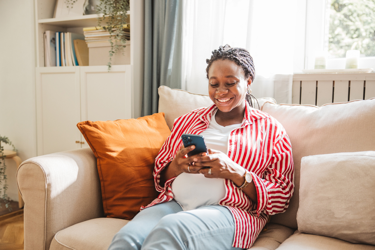 Pregnant woman relaxing on couch